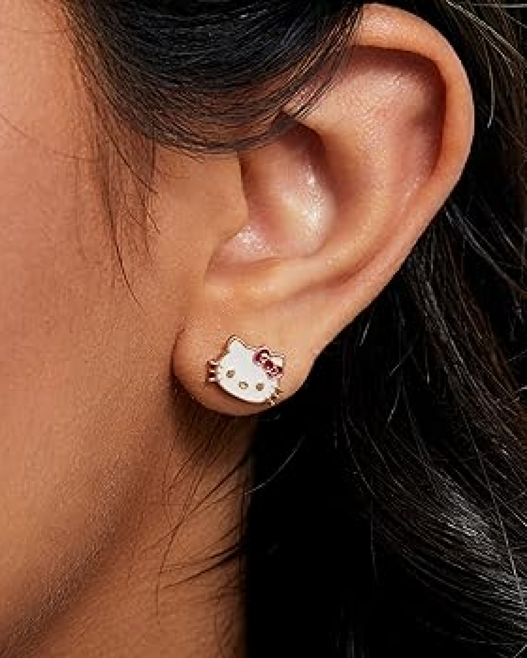 Hello Kitty Gold Outline Cat Earrings worn as chic everyday kawaii jewelry with subtle sparkle