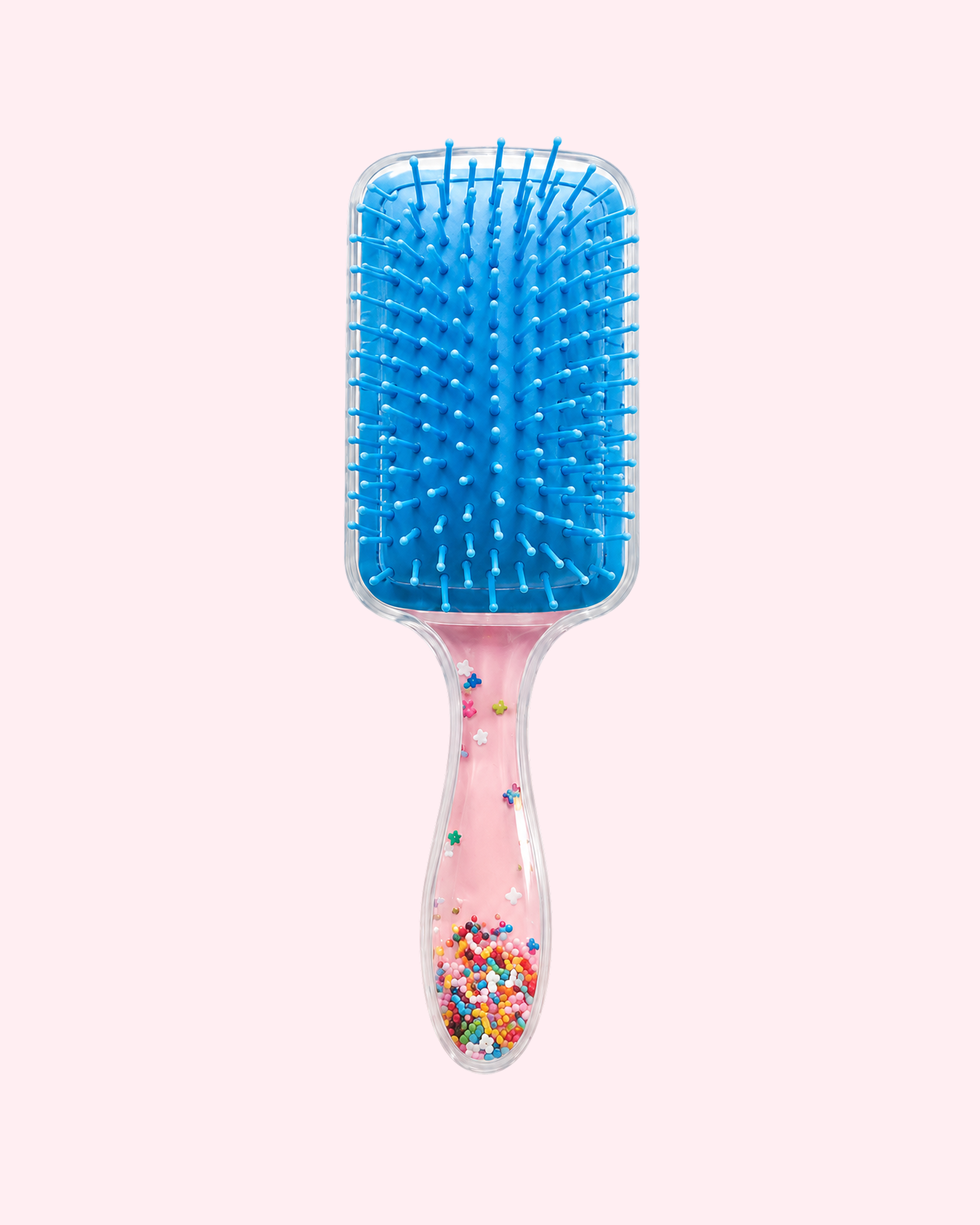 Hello Kitty Blue Glitter Hair Brush with blue bristles, transparent handle and colorful floating glitter