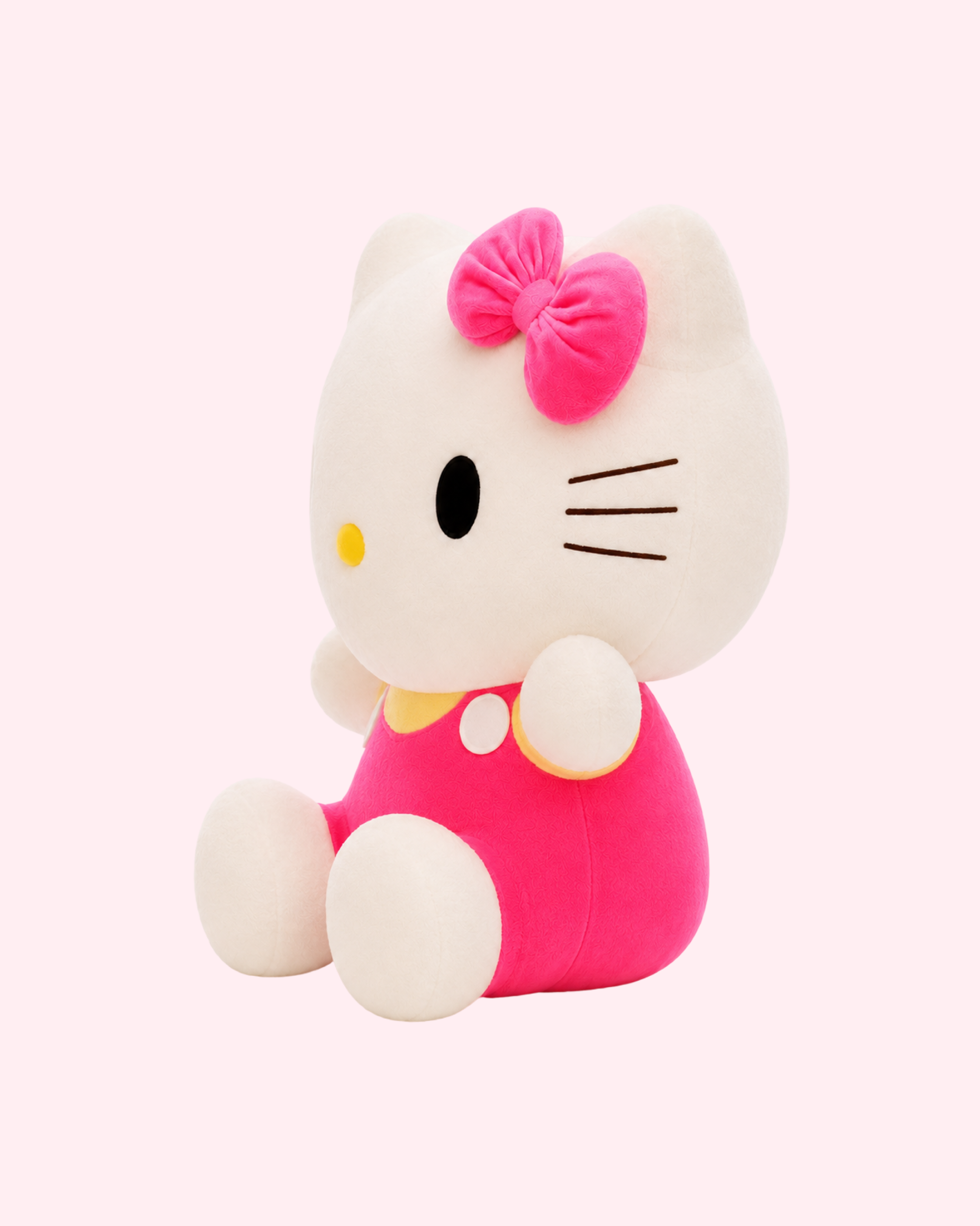 Pink and yellow Hello Kitty plush toy with adorable details and cute collectible charm