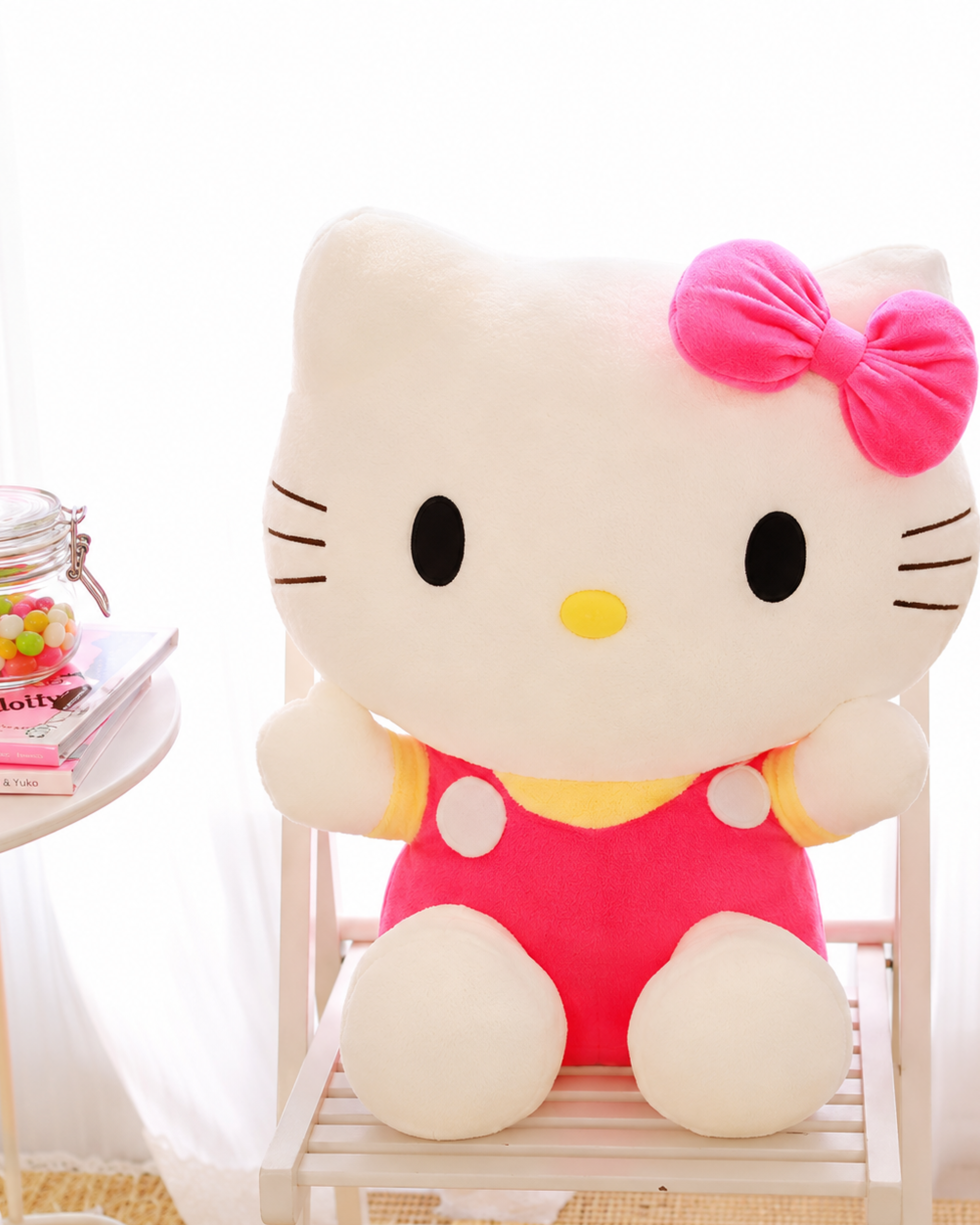 Soft pink and yellow Hello Kitty plush made for cuddles, gifts and kawaii room decor