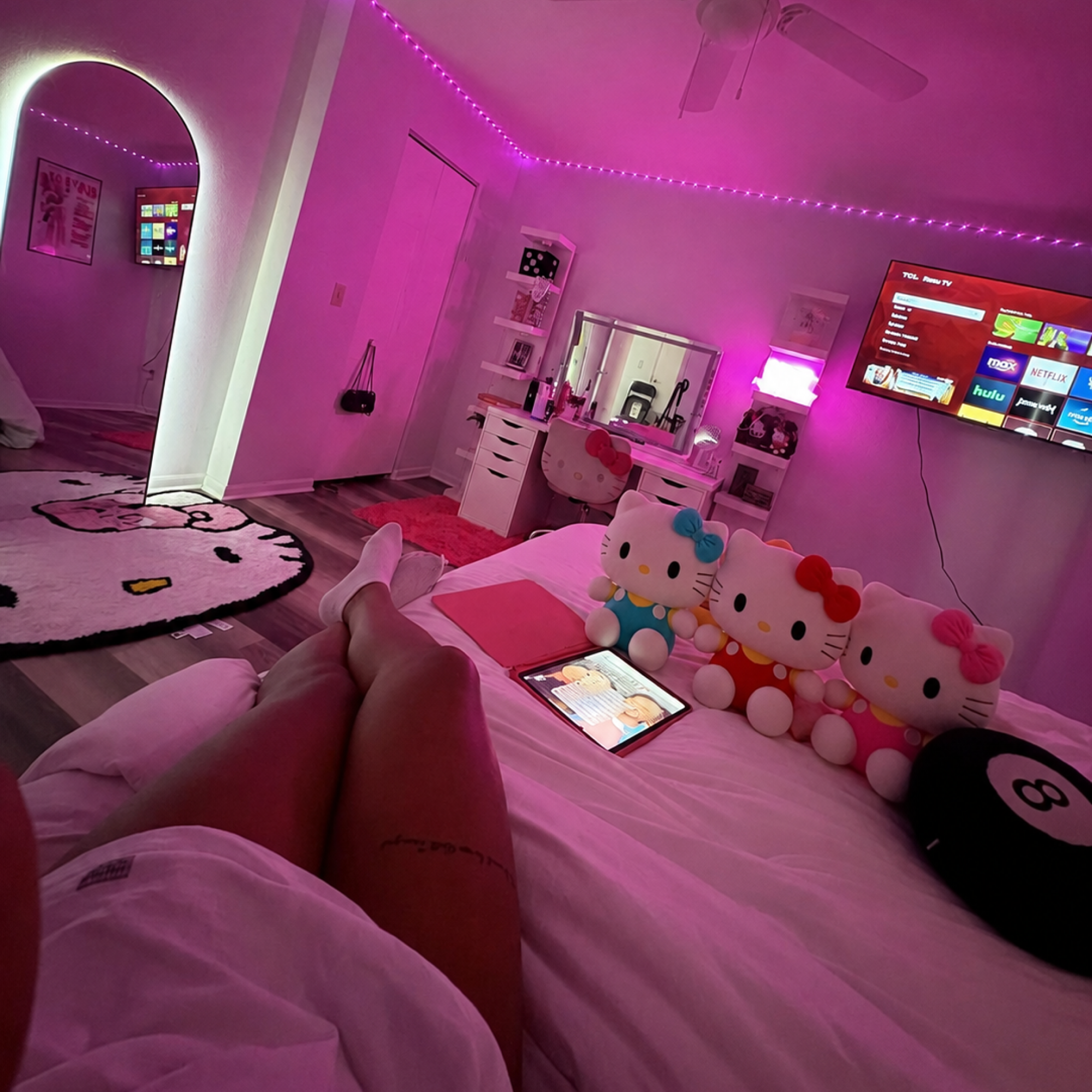 Pink and yellow Hello Kitty plush styled in a bedroom for soft cute room decoration