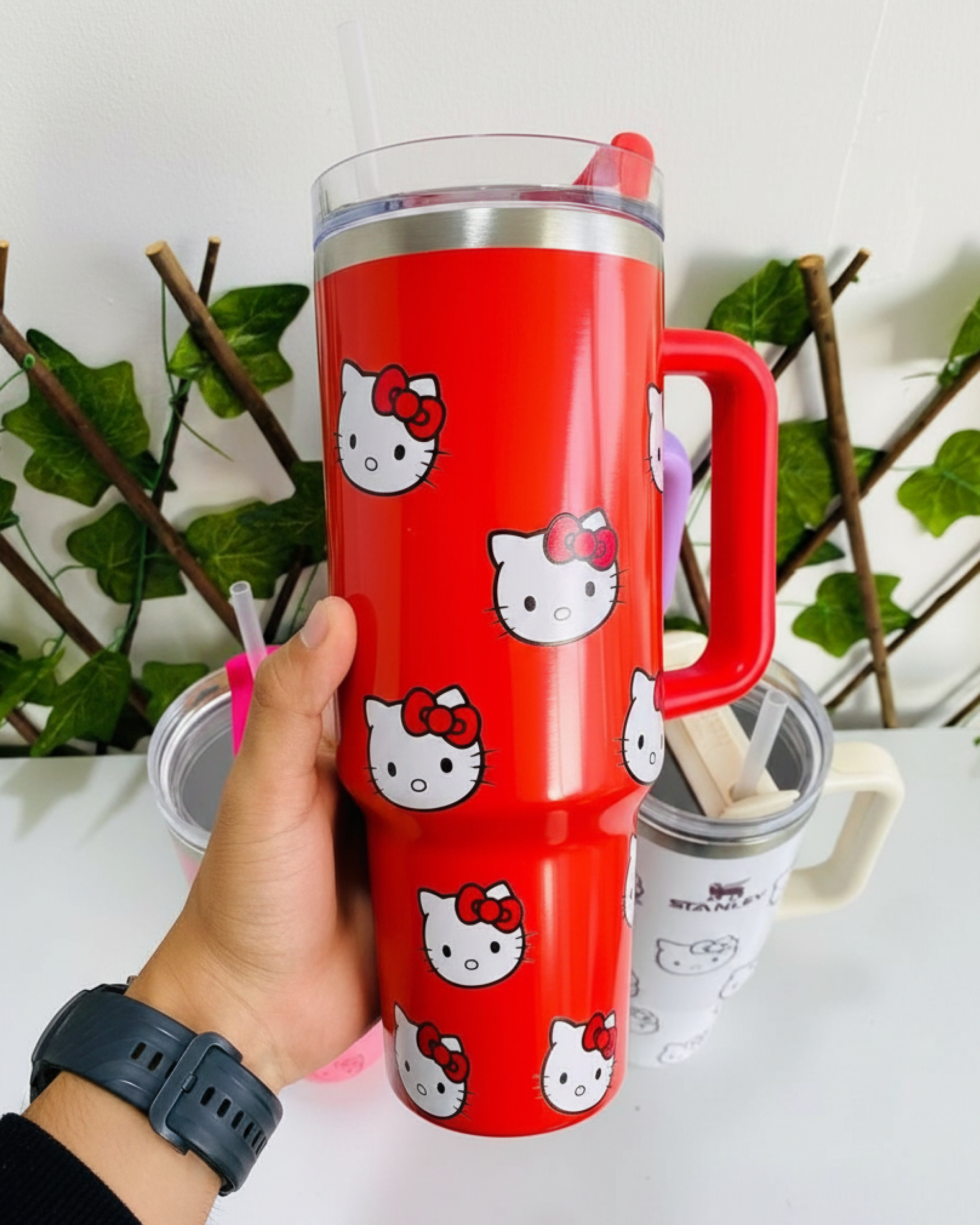 Hello Kitty Red Tumbler Cup held in hand as a cute daily drink accessory for travel and work