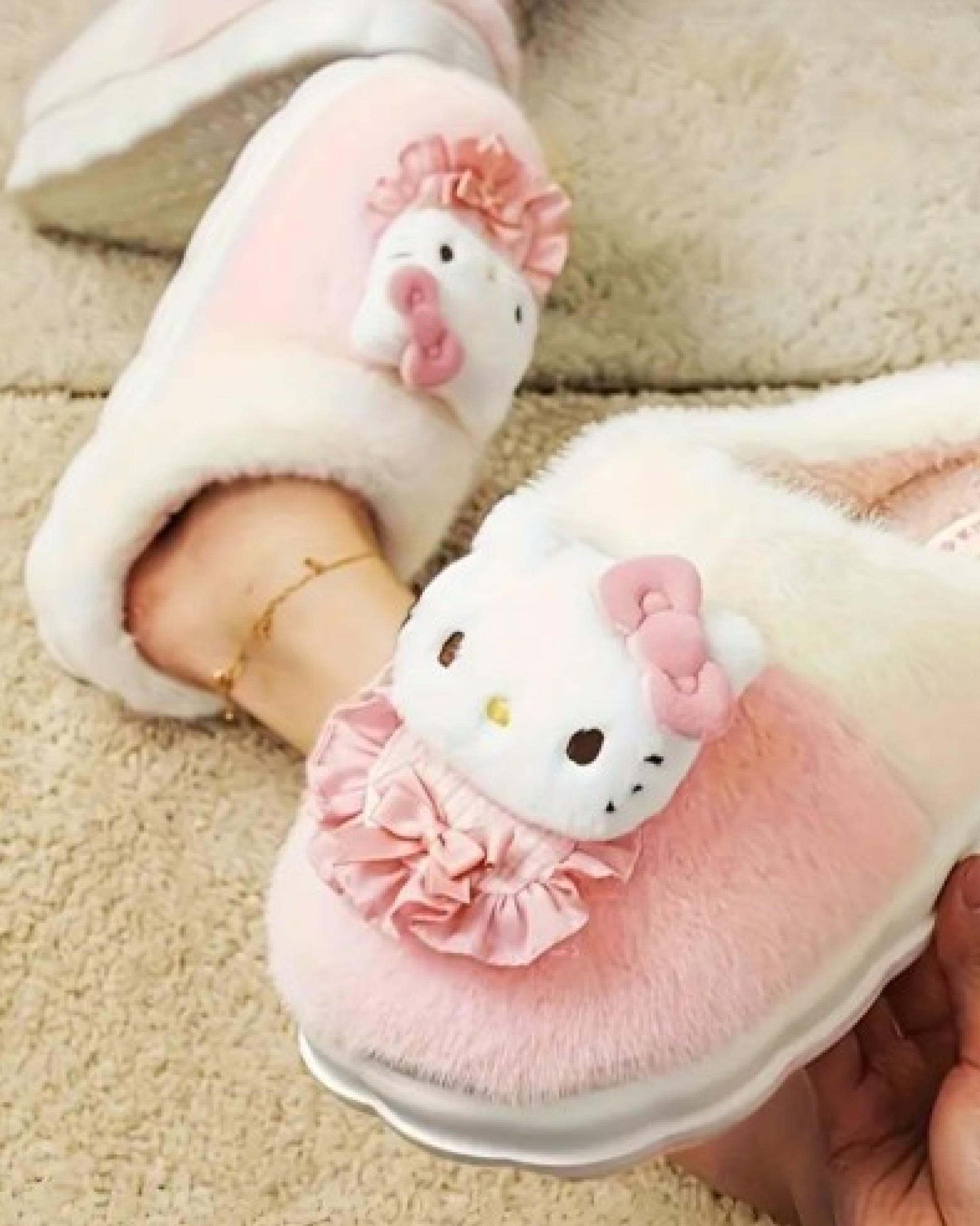 Hello Kitty plush slippers worn at home with soft pink bow detail and cozy kawaii look