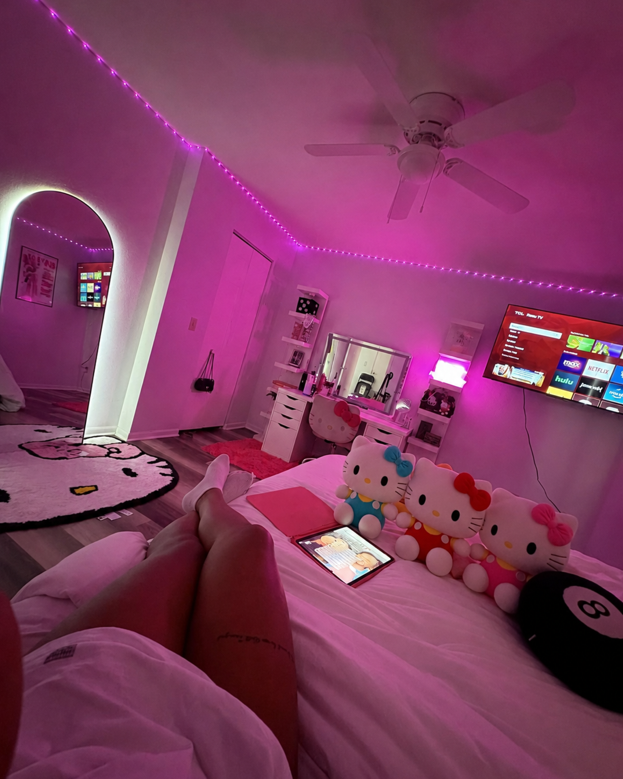 Red and yellow Hello Kitty plush displayed in a cute bedroom as cozy kawaii room decor