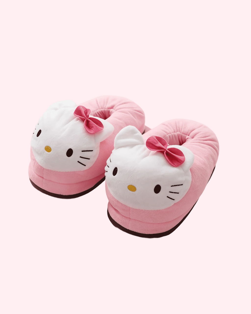 Cute pink Hello Kitty slippers with cozy plush texture for warm and comfortable home styling